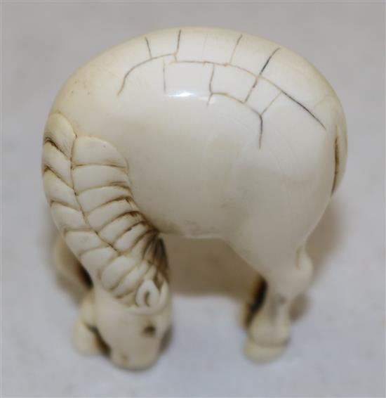 A Japanese stag antler netsuke of a horse, 18th/19th century, 4.9cm